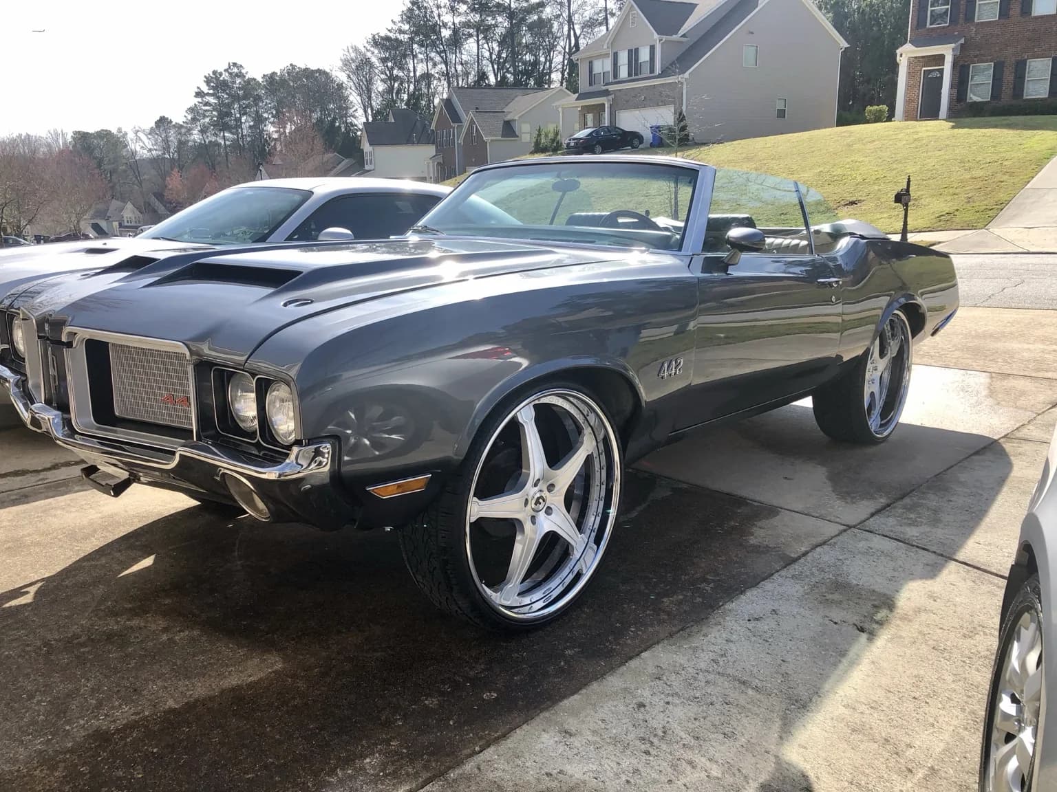 Big Lit’s gray 1972 U-code Oldsmobile Cutlass convertible with custom wheels